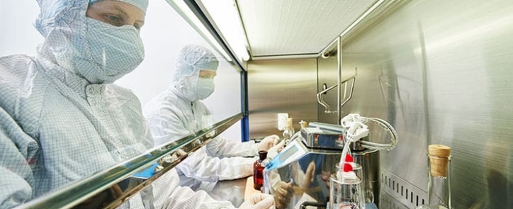 image-showing-two-staff-using-materials-and-equipment-relevant-to-their-pharmaceutical-career