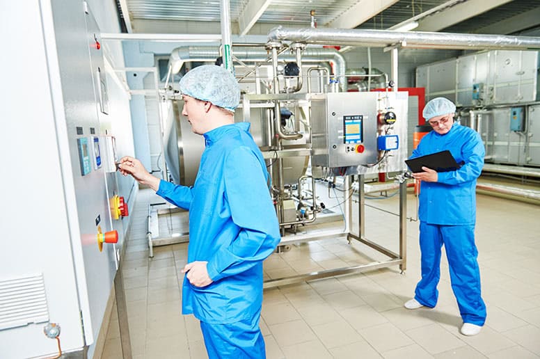 two-workers-in-facility-demonstrating-what-pharmaceutical-manufacturing-looks-like