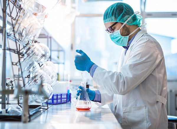 Male biotechnologist testing new chemical substances in a lab