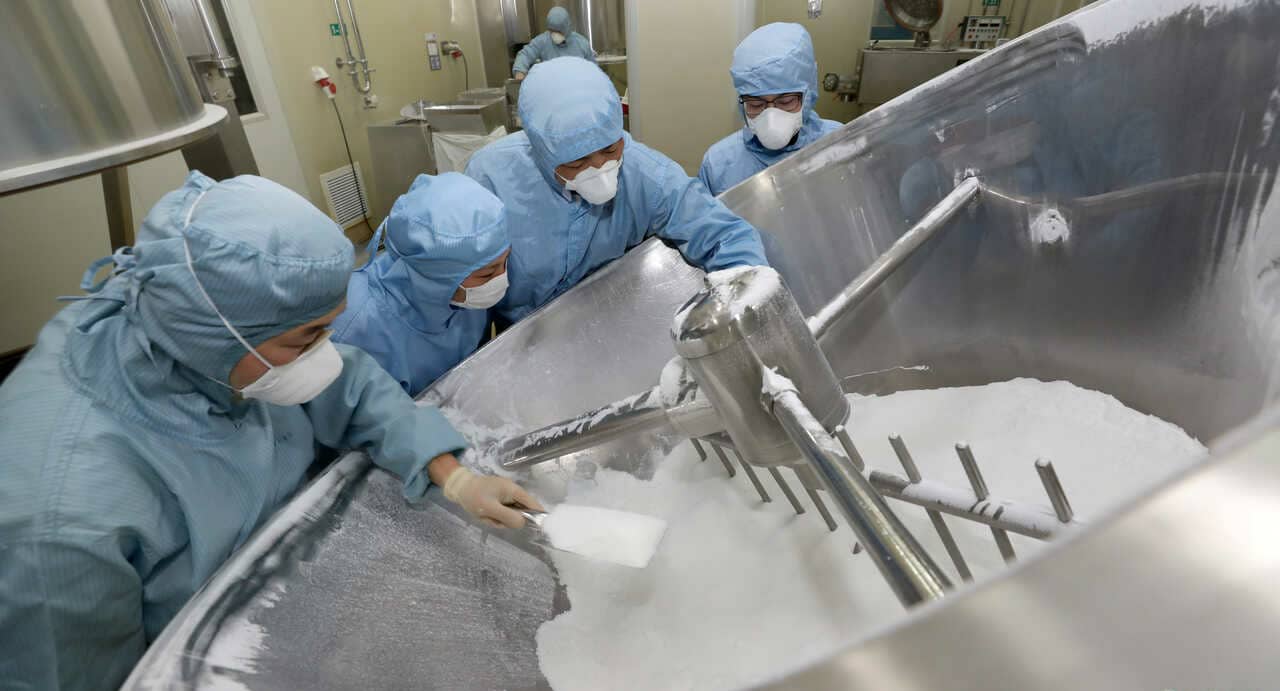 Employees work on the production line of an antimalarial drug that Chinese officials said has curative effect on the novel coronavirus disease, at a pharmaceutical company in Nantong risk assessment tools